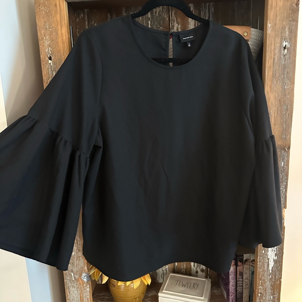 Black blouse with a puff sleeve